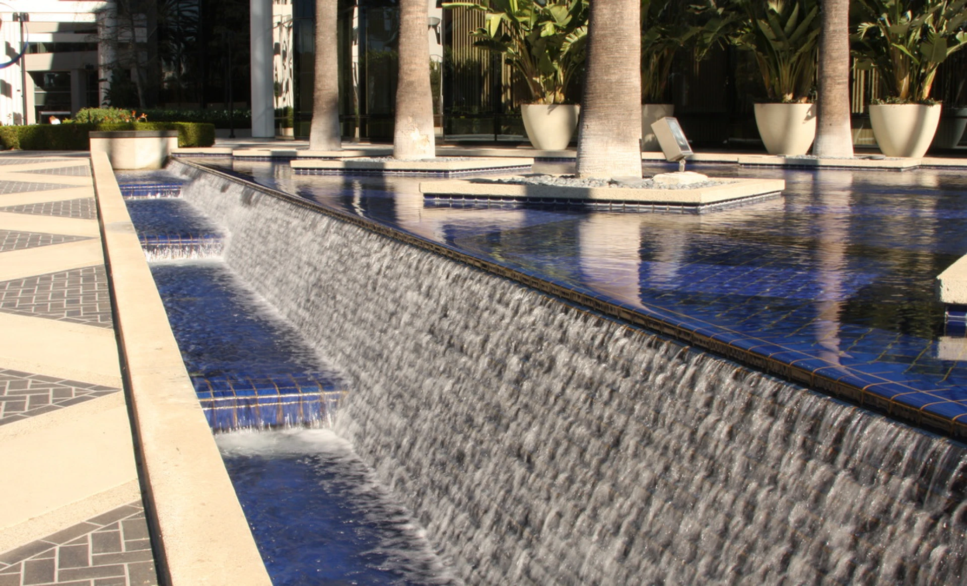 Elegant outdoor water installation with palm trees
